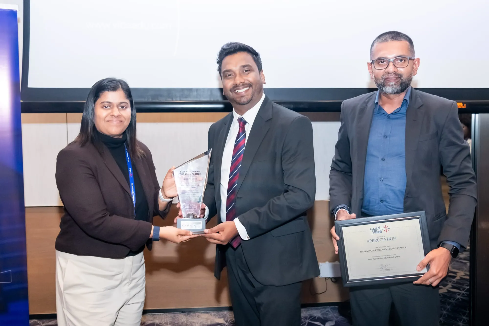 Vibe Education handing DreamPath its Best Performing Education Partner 2026 trophy