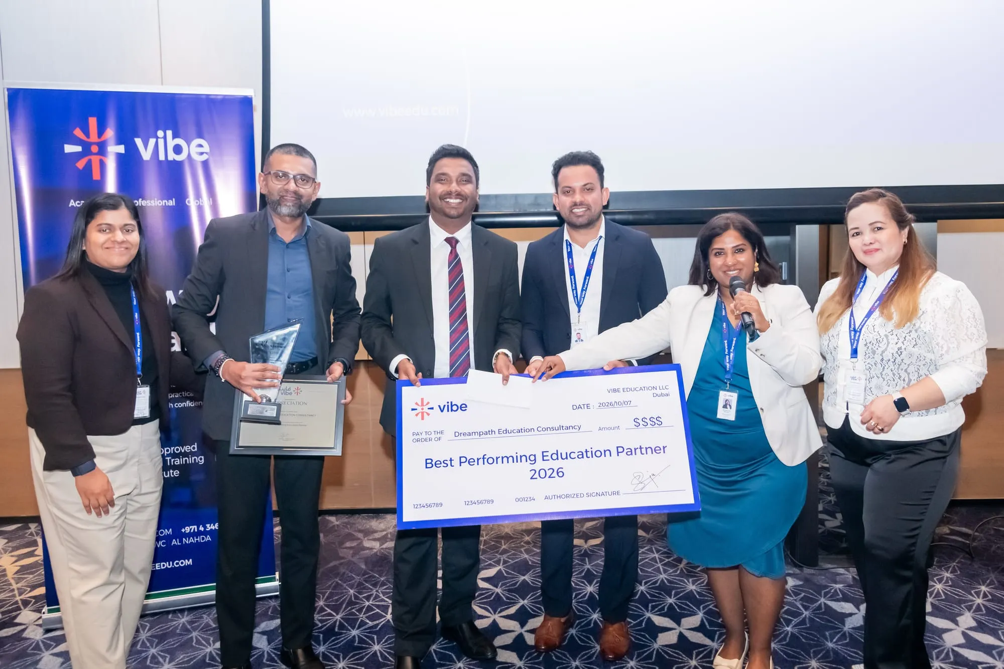 DreamPath receiving Vibe Education's Best Performing Education Partner 2026 trophy, certificate and presentation cheque